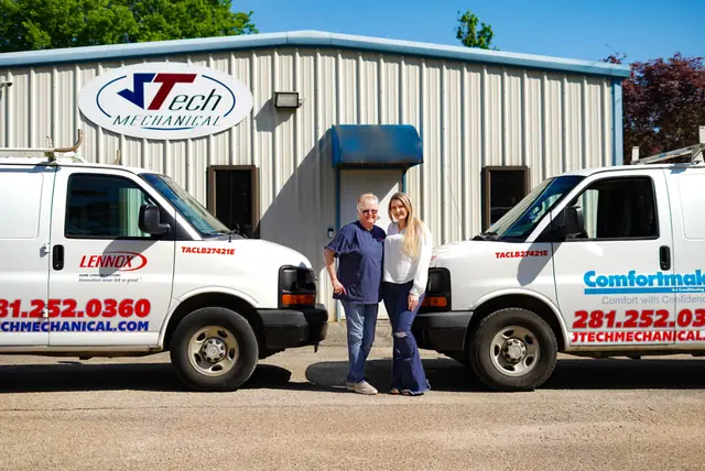 Two JTech Mechanical service vans nose to nose outside the Magnolia shop